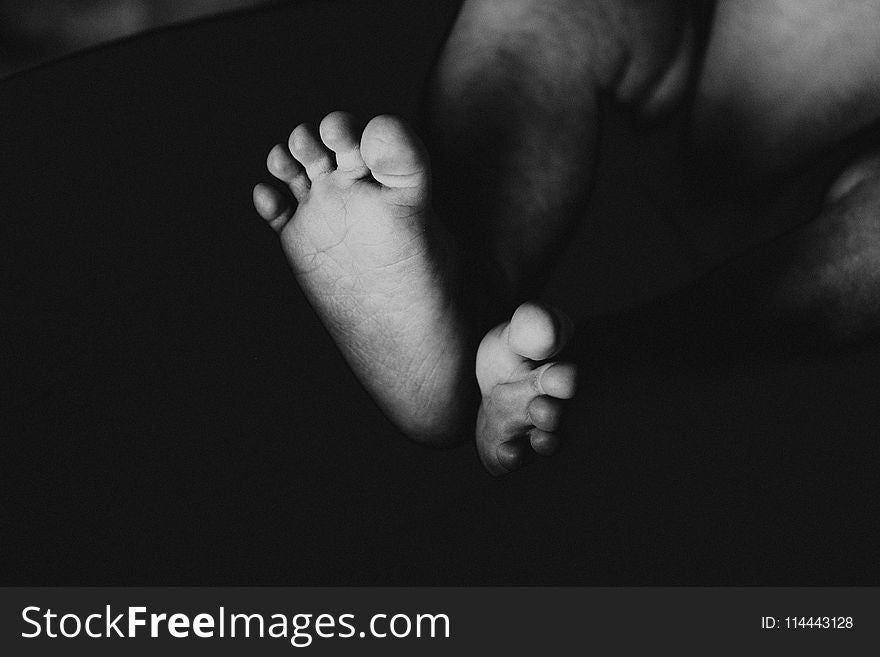 Grayscale Photography Of Baby&x27;s Feet