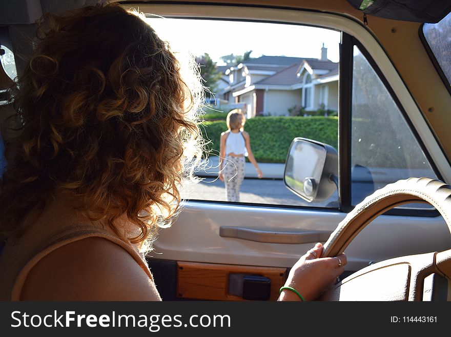 Person Driving Vehicle Looking Sideways
