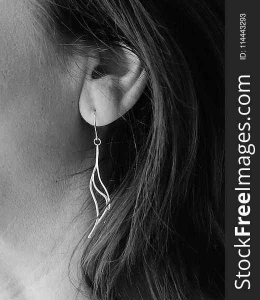 Grayscale Photo of Woman&#x27;s Hook Earrings