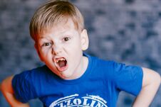 The Boy Grimaces In Front Of The Camera Stock Photos