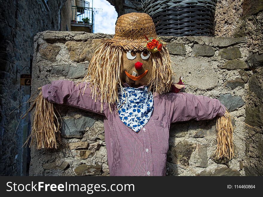 Scarecrow close up in a village of coutryside, Italy