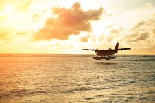 Summer Sunrise With Seaplane. Landing Seaplane On The Seashore Royalty Free Stock Image