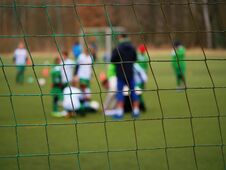 Football Gate Net. Soccer Gate Net. In Blurry Background Stand Players. Stock Images