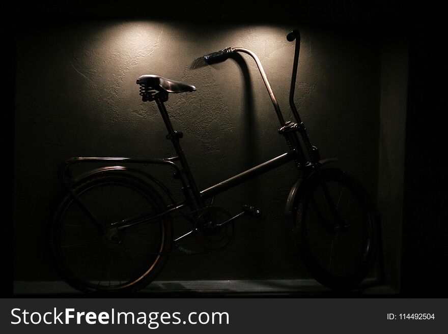 Stylish hipster bicycle in modern interior of city cafe