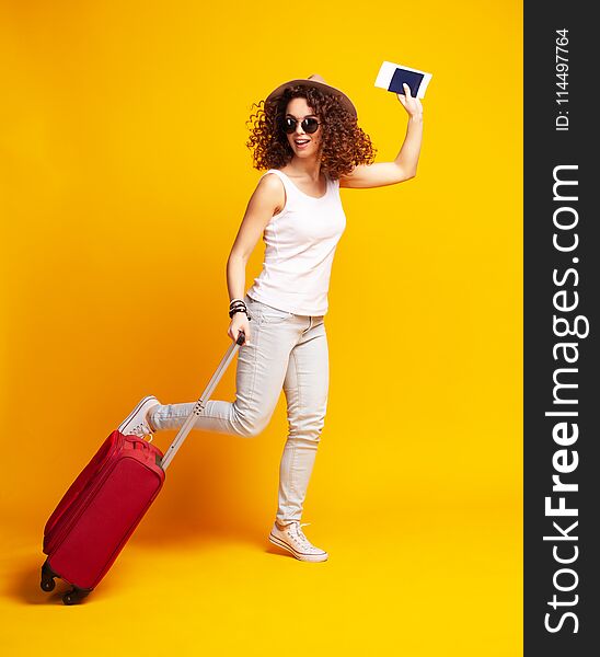 Woman Traveler With Suitcase On Color Background.