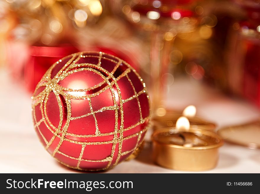 Close up on Christmas ball and red gifts