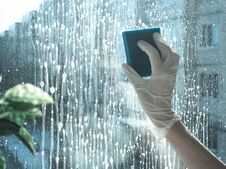 Spring Cleaning - Cleaning Windows. Women`s Hands Wash The Window, Cleaning Stock Photography