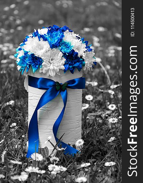 Flower arrangement of blue and white chrysanthemums in luxury handmade gift box . Flower arrangement of blue and white chrysanthemums in luxury handmade gift box .