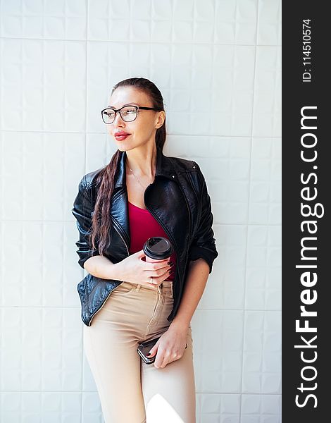 Photo of Woman Wearing Black Leather Jacket