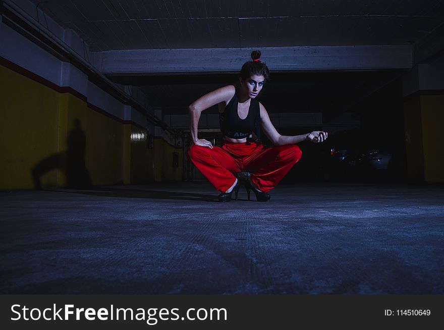 Photo Of Woman Wearing Sports Bra And Red Pants