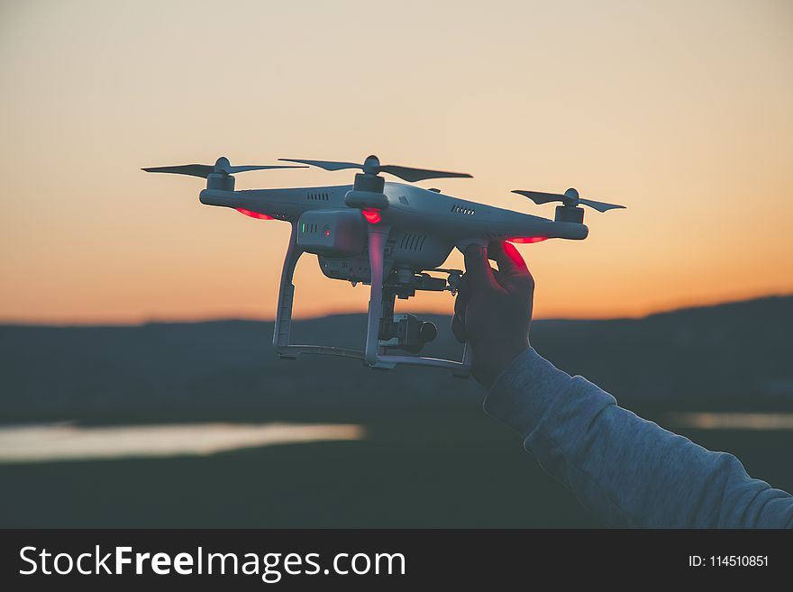 Photo of Person Holding Drone