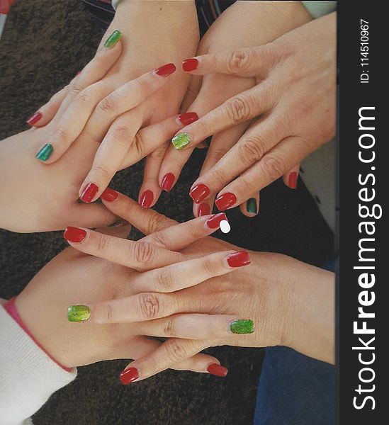 Women Holding Hear Hands Showing Their Nail Polishes