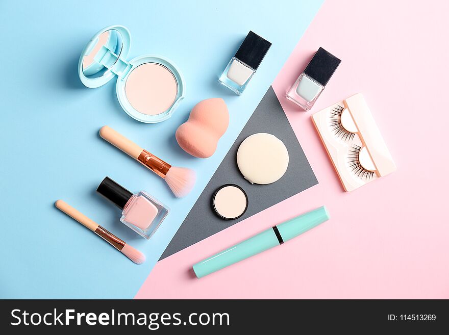 Flat lay composition with cosmetic products on color background