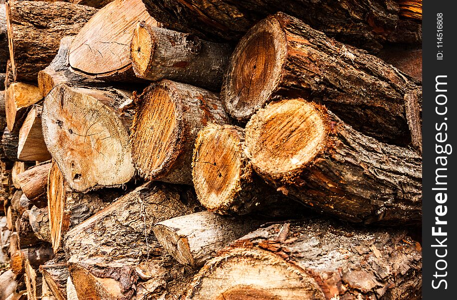 Cross sectional wooden log pile background, construction material or interior concept.