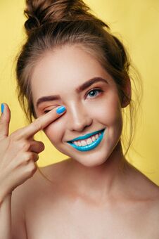 Beauty Art Portrait Of White Young Smiling Girl In Pastel Tones Blue Caramel Makeup. Vertical Photo Stock Image