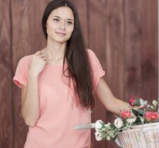 Portrait Of A Young Woman With Bicycle And Spring Flowers In A Basket Stock Photos