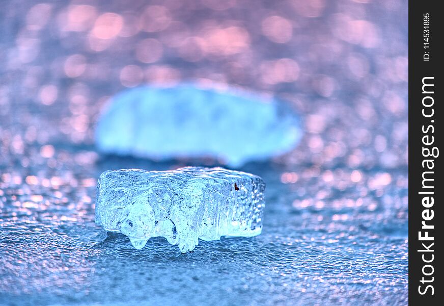 Ice Shard And Small Cracked Ice Pieces On Melring Glacier. Icy Fragments Are Melting