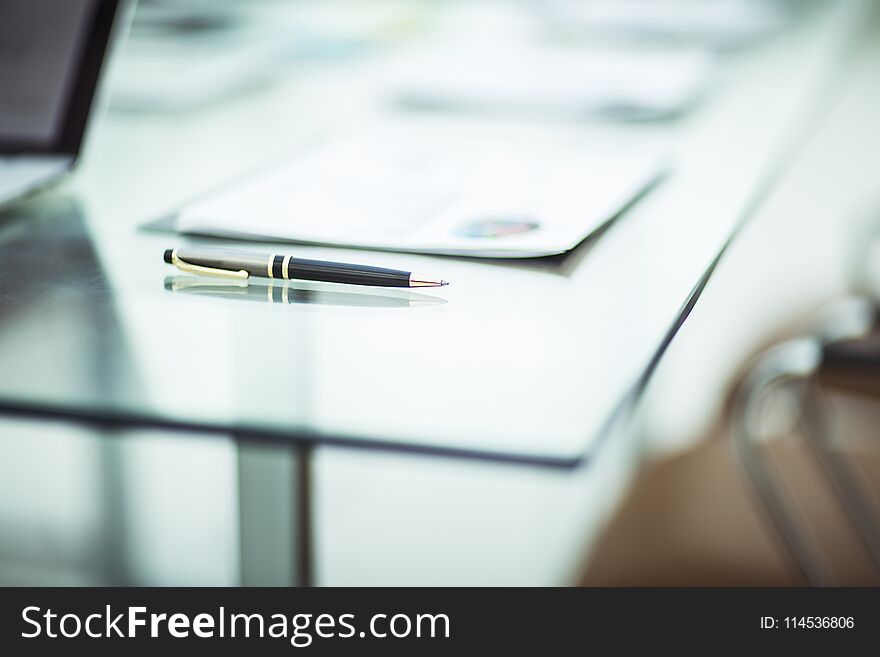 Close-up of pen and financial documents on the table of the businessman. the photo is a blank space for your text