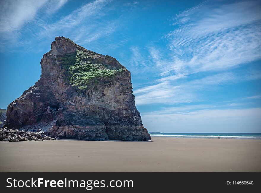 Rock formations on a beach in a low tide on a sunny summer day. Rock formations on a beach in a low tide on a sunny summer day.