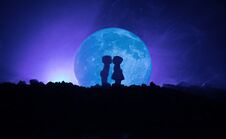Silhouette Of Couple Kissing Under Full Moon. Guy Kiss Girl Hand On Full Moon Silhouette Background. Valentine`s Day Decor Concept Royalty Free Stock Photos
