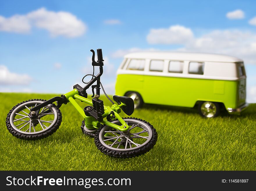 Tourist minivan and bicycle outdoors