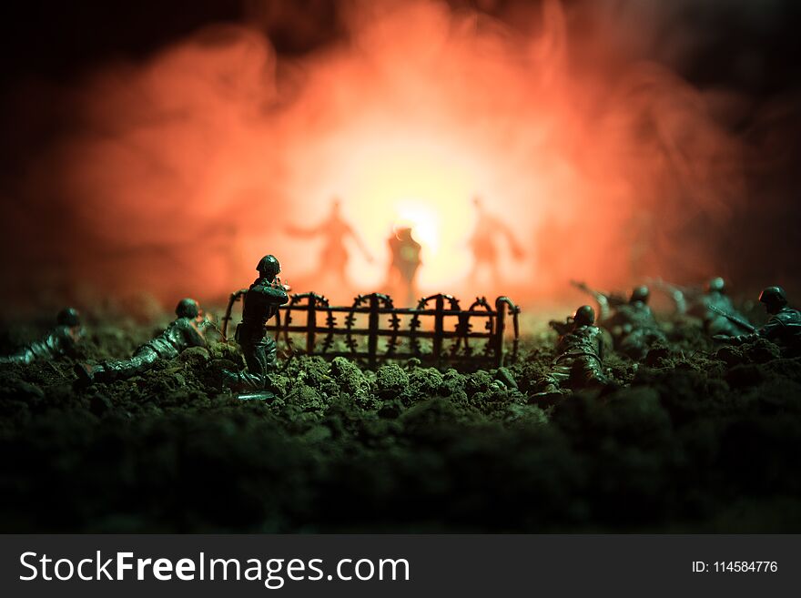 War Concept. Military Silhouettes Fighting Scene On War Fog Sky Background, World War Soldiers Silhouettes Below Cloudy Skyline At