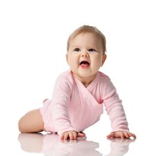 Infant Child Baby Girl Toddler Lying In Pink Shirt Learning To Crawl Happy Screaming On A White Royalty Free Stock Photos