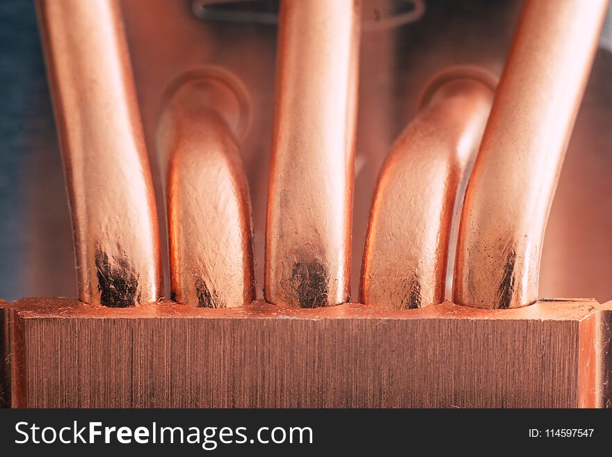 Aluminum radiator with copper heat pipe close-up with beautiful bokeh Metallic