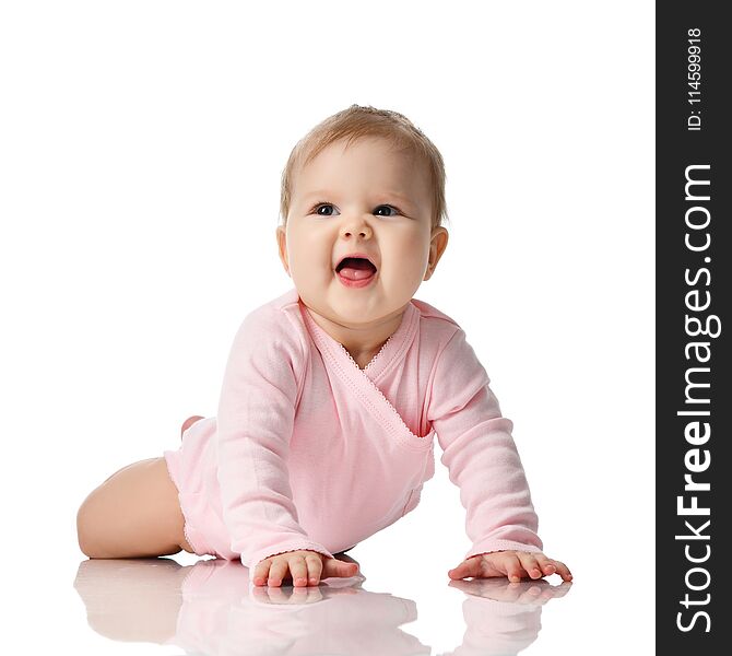 8 month infant child baby girl toddler lying in pink shirt learning to crawl happy screaming on a white background