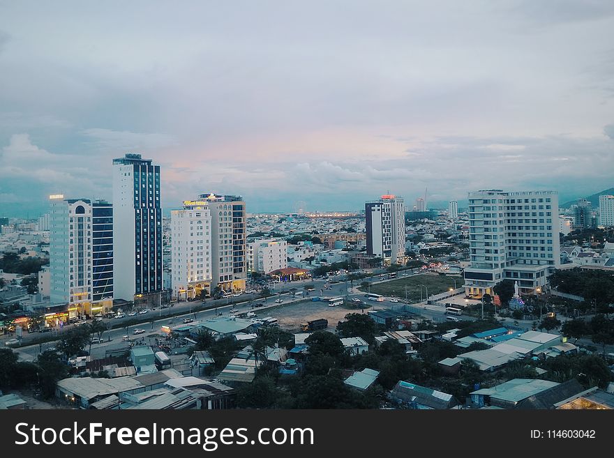 White and Gray Concrete High-rise Buildings at Daytime