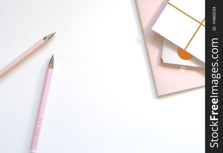 Two Pink Ballpoint Pens On Table