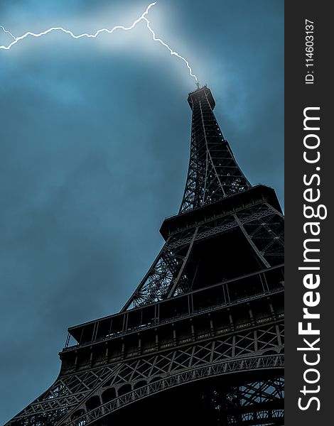 Low-angle Photo of Eiffel Tower Struck by Lightning