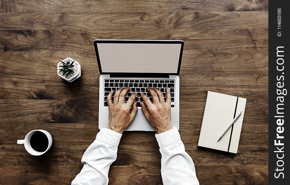 Human Using Black And Silver Laptop Computer