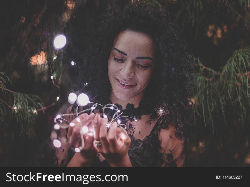 Close-Up Photography Of Woman Holding Lights