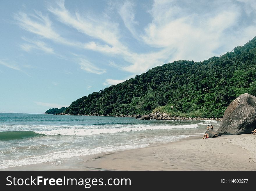 Photography of Seashore Near Mountain