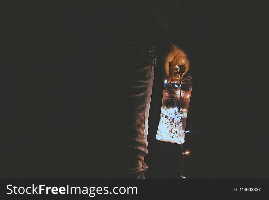 Person Holding Glass Jar