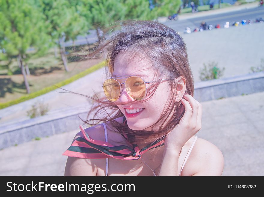 Photography of a Woman Wearing Eyeglasses