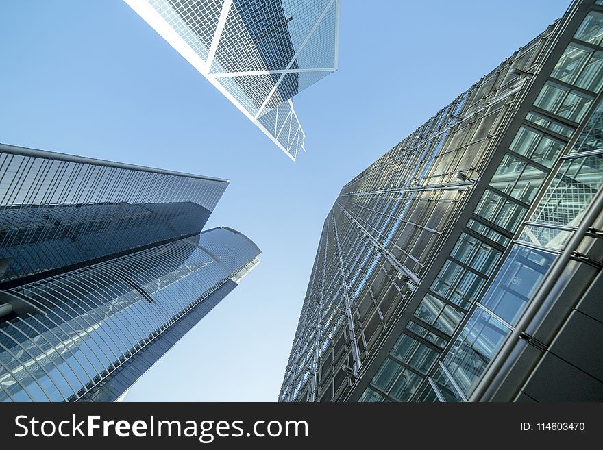 Low Angle Photography of Buildings Under Blue and White Sky