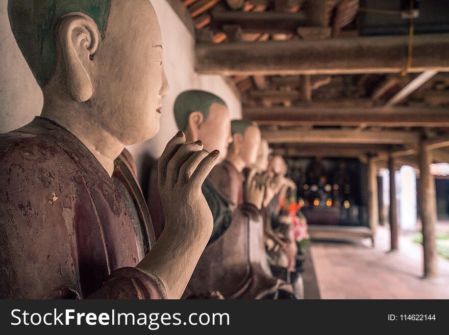 Beautiful Royalty free stock photo. a row of buddah statues in vietnam