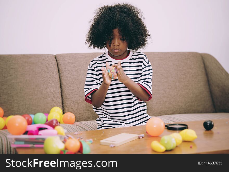 Child playing toy in the living room.