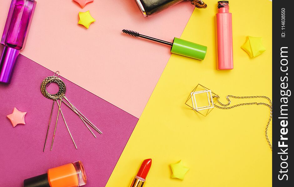 Flat lay photography with Cosmetics and accessories on colorful background