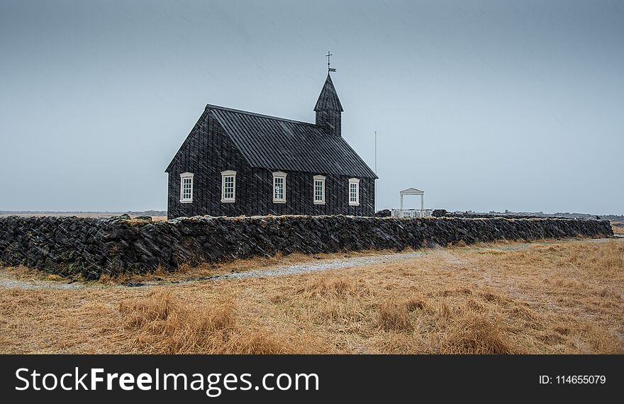 Famous picturesque black church of Budir at Snaefellsnes peninsula region in Iceland during a heavy snowy weather. Famous picturesque black church of Budir at Snaefellsnes peninsula region in Iceland during a heavy snowy weather