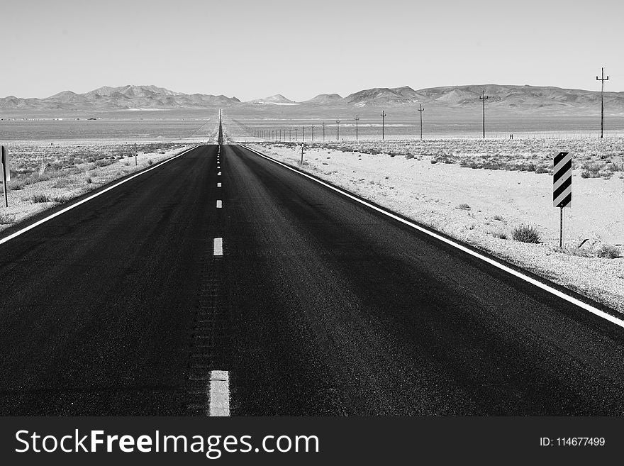 Grayscale Photo of Road on Desert