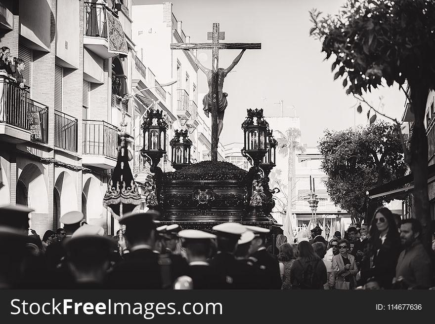 Greyscale Photo Of Group Of People Carrying Crucifix