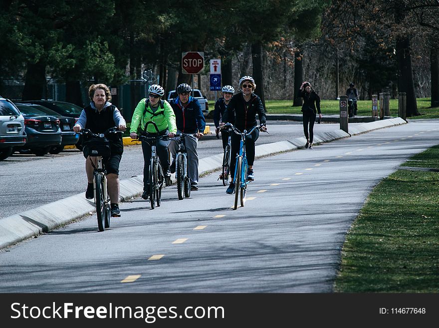Five Person Riding Bikes