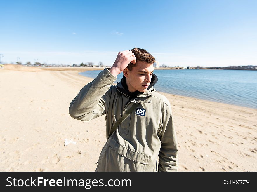 Photography of a Man on Seashore