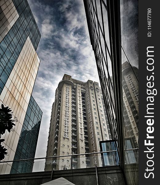 Low-angle Photo Of Brown And Gray Concrete Building