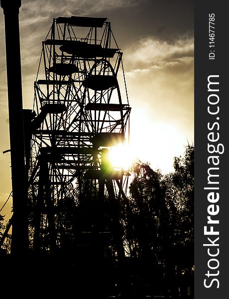 Silhouette of Ferris Wheel During Dusk