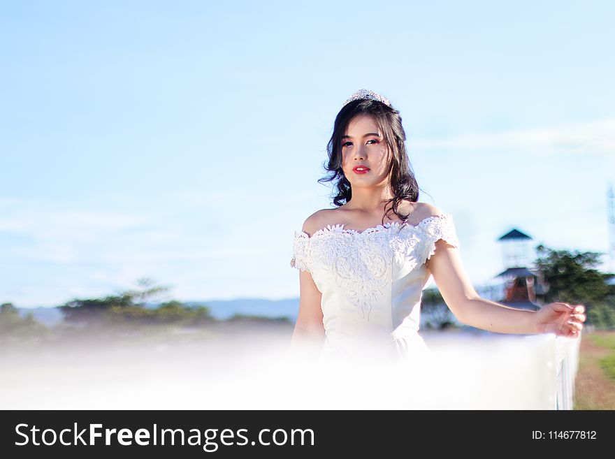 Woman In White Off-shoulder Gown