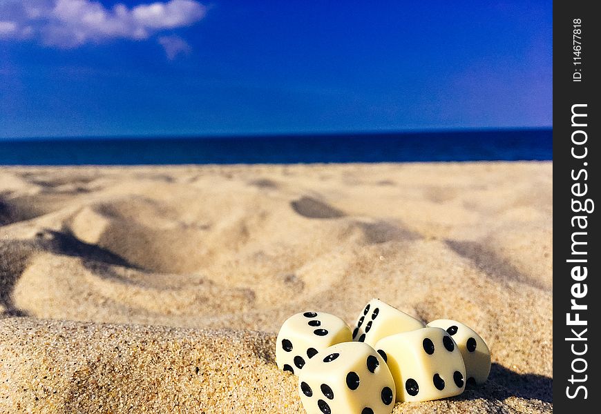 Five Dice on Sand